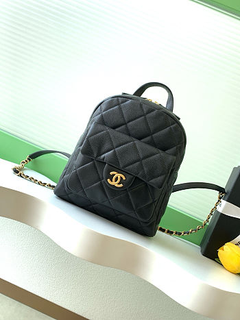Chanel CC Mini Classic Backpack in black caviar quilted leather.