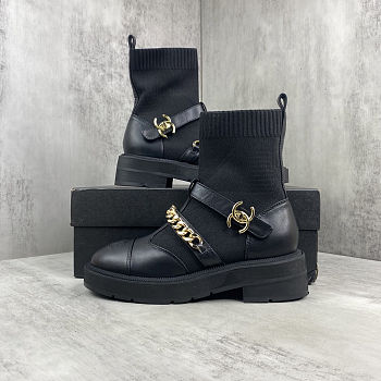 Chanel short boots with a chain