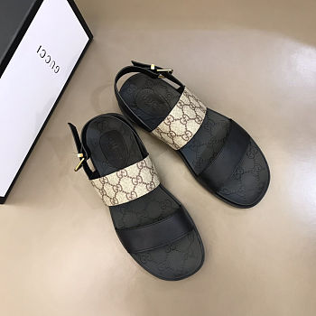 Gucci sandals with a black leather and GG canvas strap