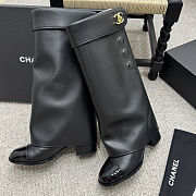 Chanel black leather fold-over boots with a cap toe and button details  - 1