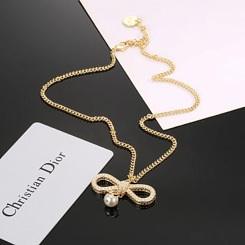 Christian Dior ribbon bow necklace with a gold-plated chain