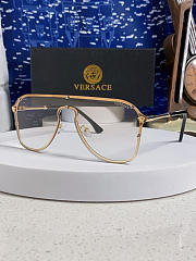 Versace pilot-style eyeglasses with a gold metal frame  - 1