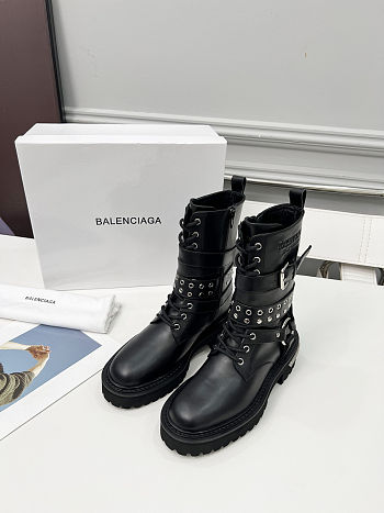 Balenciaga black leather boots with straps and studded details
