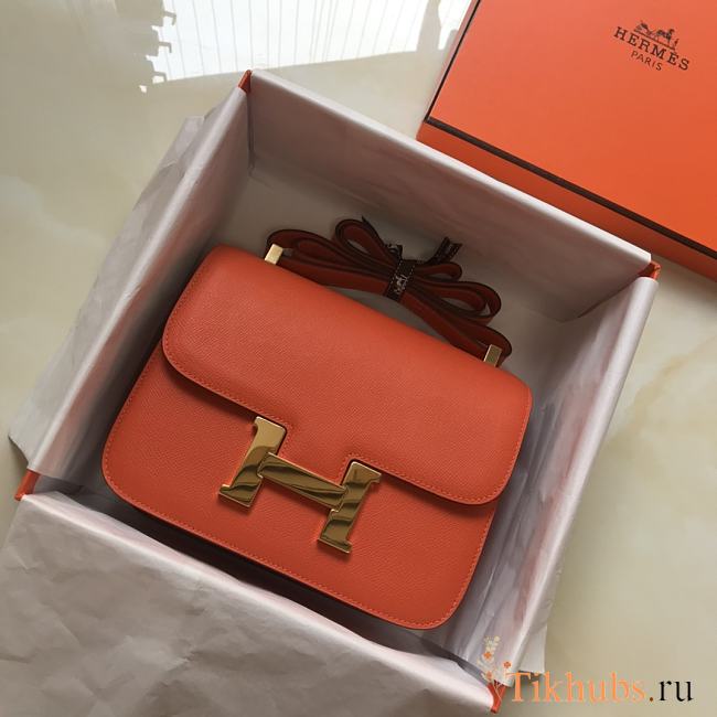 Hermès Constance 18 bag, featuring orange leather with gold hardware  - 1