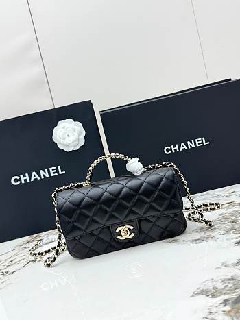 Chanel Mini Classic handbag in black has a handle embellished with rhinestones size 20x7x12 cm