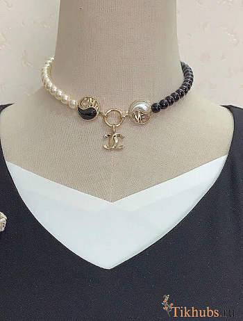 Chanel necklace is the A23C Pearl Mark