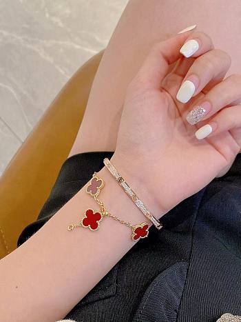 Van Cleef & Arpels Vintage Alhambra bracelets featuring red carnelian clover motifs